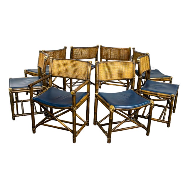 Late 20th Century Campaign Style Set of 8 Dining Chairs by McGuire Rattan Cane & Navy Leather For Sale