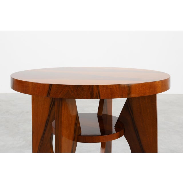 A refined and sculptural French Art Deco table from the 1920s, crafted in solid wood and recently refinished to highlight...