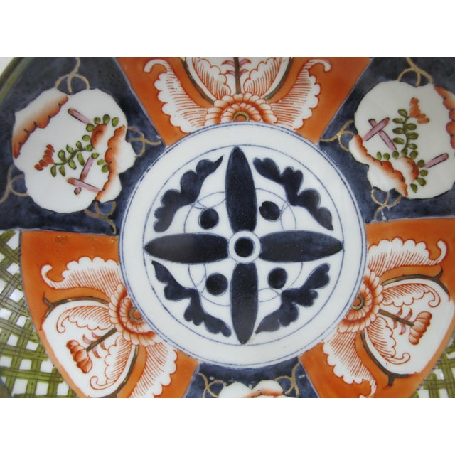 Mid Century Modern Saks Fifth Avenue Japanese porcelain shallow bowl or plate with brass covering. Hand decorated with...