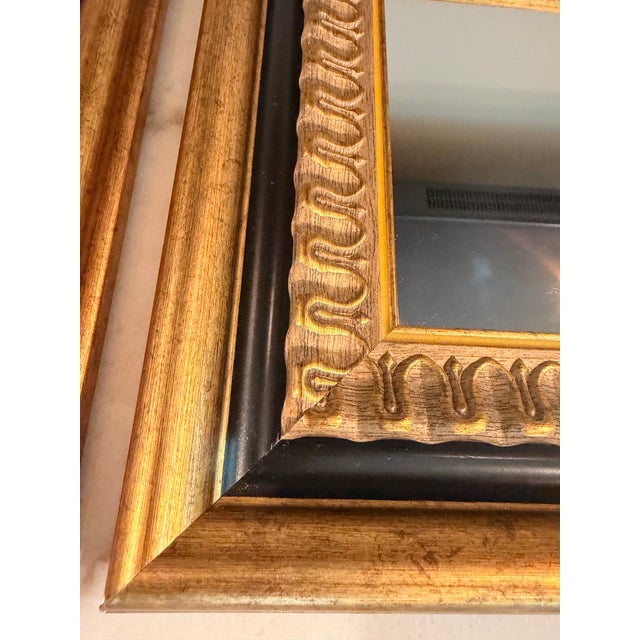 Bring warmth and architectural detail to any room with this striking pair of vintage wall mirrors. Each mirror features a...