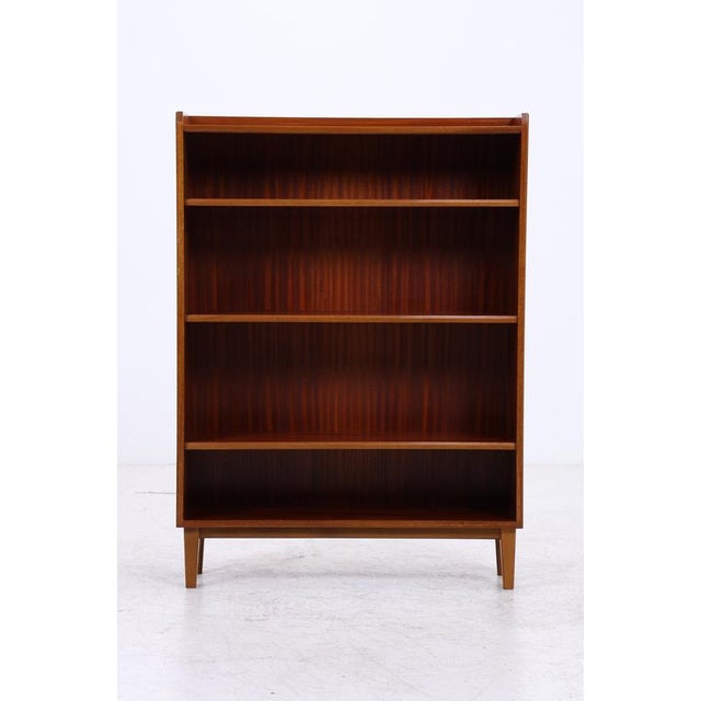 Vintage mahogany shelf with clean, straight lines and a striking dark grain. The four spacious compartments offer plenty...