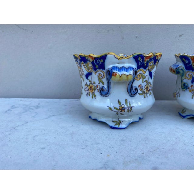19th Century Pair Of French Faience Cache Pots Desvres , hand painted with flowers on one side and coat of arms on the...