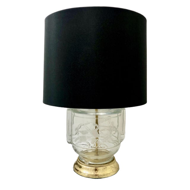 This pair of table lamps features a highly distinct Art Deco aesthetic characteristic of 1930s glass artistry. The...