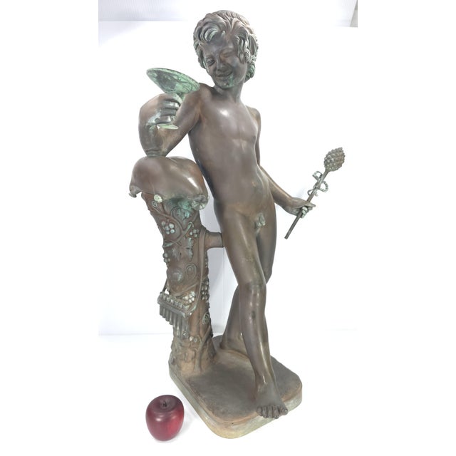 This antique Grand Tour bronze sculpture features a patinated rich brown/green patina with spots of verdigris coloration...