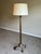 Sophisticated bronze-tone floor lamp attributed to Baker, featuring an elegant neoclassical inspired silhouette with...