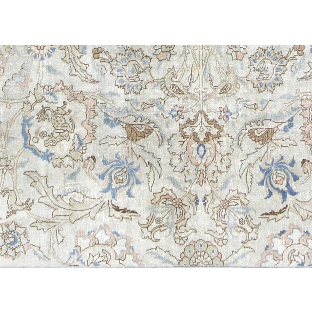 This Semi Antique Persian Tabriz Rug is handwoven in Northern Iran’s Tabriz region and has been carefully distressed and...