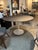 Knoll Eero Saarinen Round Pedestal Dining Table with Dark Top and White Tulip Base A timeless icon of mid-century modern...