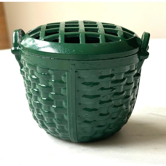 Zinc painted flower frog. In the shape of a Nantucket basket. Top comes off to clean and add water. A dark British racing...
