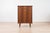 This beautiful teak chest of drawers was manufactured in Scandinavia in the 1960s. It features a simple, elegant form and...