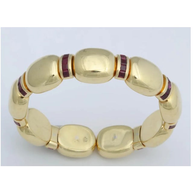 Signed Faraone 18kt Expandable Cuff made up of 9 segmented oval sections each separated by curved bars set with 5 French-...