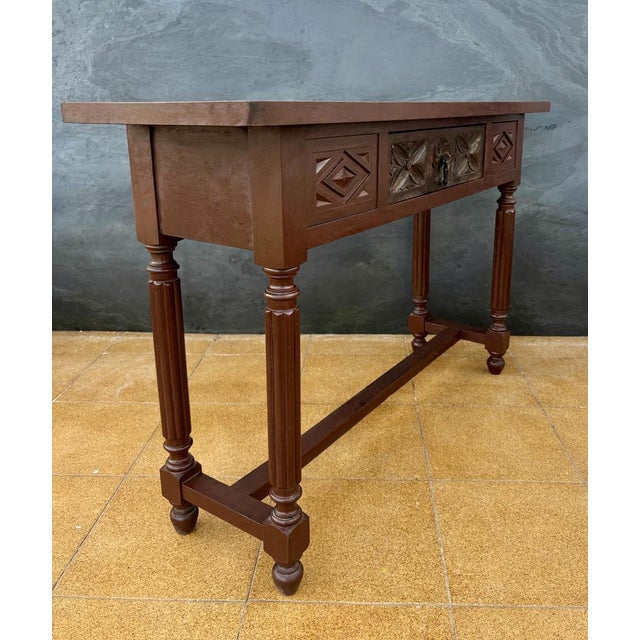 Elegant Spanish console table in the Renaissance Revival style, dating from the early 20th century. Crafted in solid oak,...