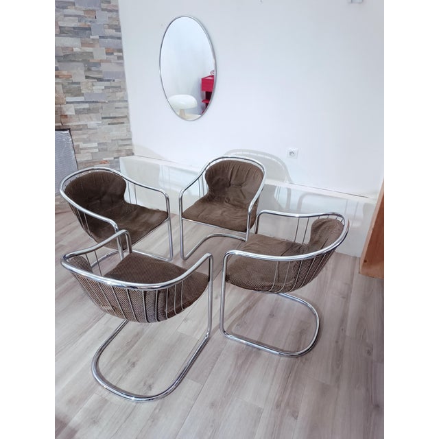 Magnificent set of four cantilever chairs by Gastone Rinaldi for Rima. Padua, Italy, 1970s. Tubular chromed metal frame....