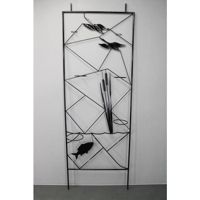 A rare and highly decorative Mid Century room divider produced in Czechoslovakia during the 1970s. Crafted from black...