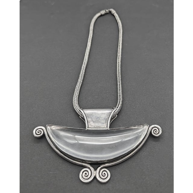 Offered is an artisan-crafted quartz and sterling silver pendant that was obtained on a trip to India in the late 1980s....