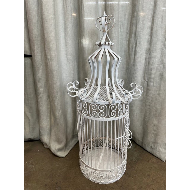Gorgeous French design handmade wrought iron Palm Beach estate sale find white finish birdcage.