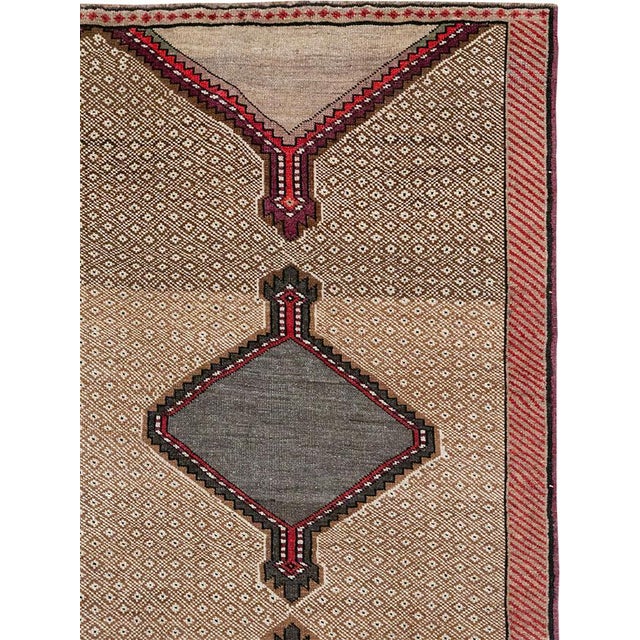 This Mid-20th century Turkish Anatolian wide gallery runner presents a striking, highly graphic composition organized...