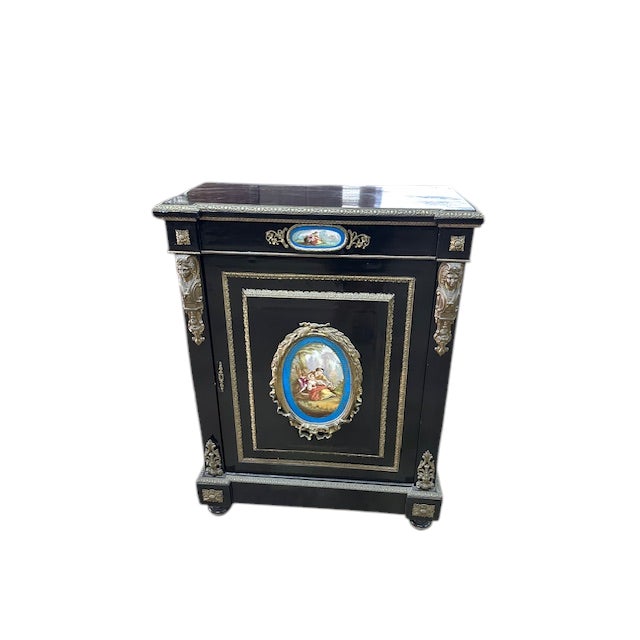 A really nice French pier cabinet. It is made from ebonized mahogany. It has Sèvres porcelain plaques and bronze mounts....