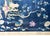 A wonderful early 20th century Chinese Art Deco rug with a dark indigo field surrounded by a lacy floral and scrolling...