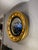 This is an antique convex gilt mirror. It has a federal rondel ball details around the rim. It is absolutely stunning.