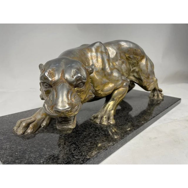 Beautiful sculpture by A.Santini depicting a Jaguar made of pewter covered in "Argentone," with a base of Granite marble...