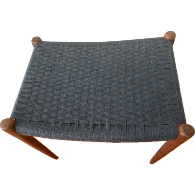 Classic Moller bench in teak with original woven top. Top is woven in beautiful wool cord in a soft medium blue with...