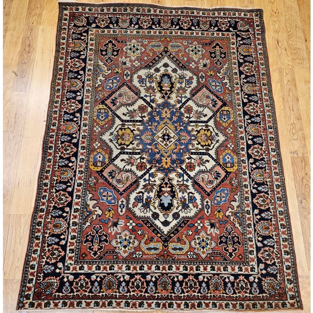"This exquisite vintage Persian Tabriz area rug from the early 1900s features a striking Heriz-Serapi inspired pattern — a...