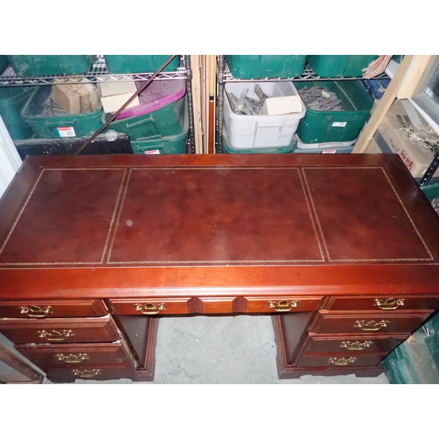Gently used Broyhill office desk. 7 drawers, leather top inlay, Mahogany finish