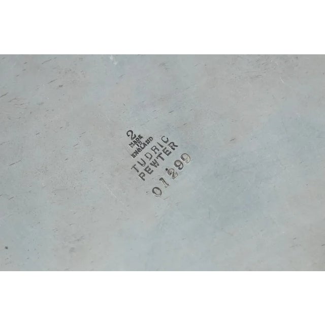 Beautiful antique candlestick, made of pewter and english oak. Stamped at the bottom "Tudric Pewter 01299" "made in...