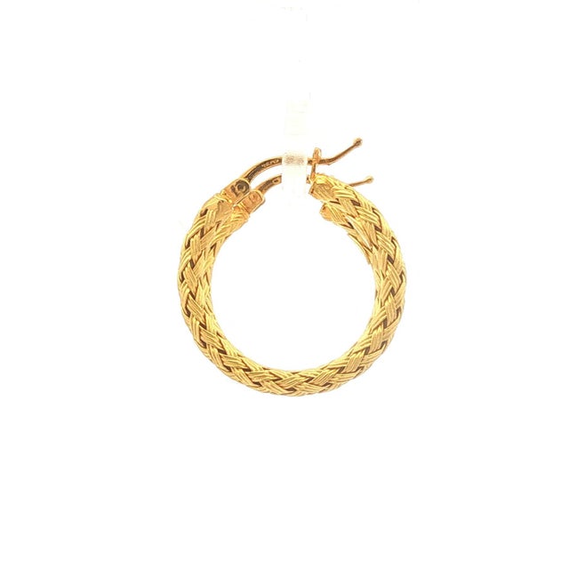 A pair of 18k gold hoop earrings with a braided design. These are elegant and in good condition. Height is 1.0 inch.