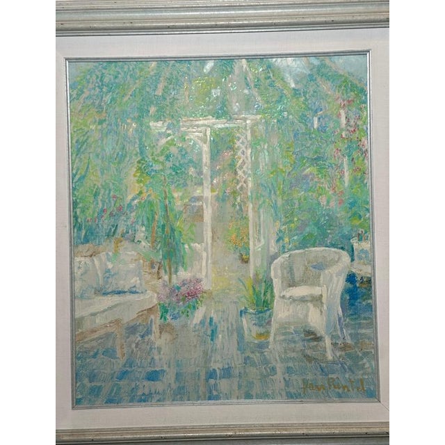 A bright and serene impressionist scene by Theo Van Rintel, depicting a peaceful garden terrace with white wicker seating,...