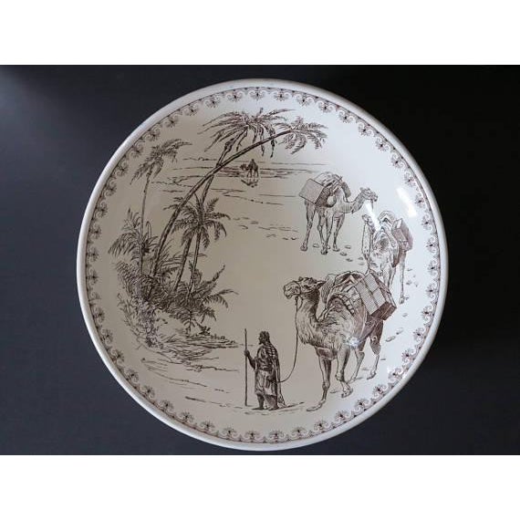 Massive English dark brown transferware bowl in the "Arab" pattern by powell & bishop from 1877. The bowl is marked on the...