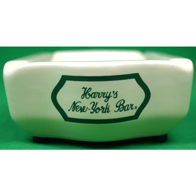 Sz: 9 1/2"L x 5"W x 2"H Underside of ashtray reads: "Harry's Bar, Harry's New York Bar and the Barflies Logo are...