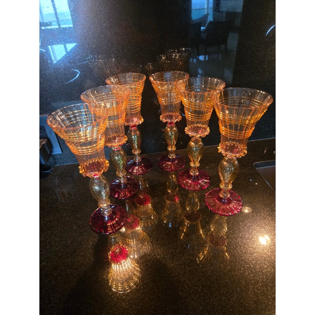 Multii-colored Triad Design: The glasses rely on classic Murano three-part structural composition. They feature...