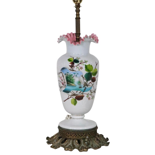 Charming pair of antique glass vases, later mounted as lamps. The vases feature cased glass bodies with pink interiors,...