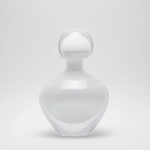 Introducing the epitome of elegance and refinement: the hand-blown Murano bottle in a pristine clear crystal finish,...
