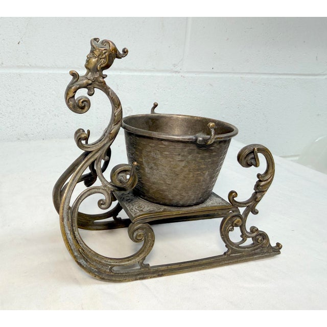 This antique 19th-century bronze Victorian sleigh shaped ring holder is a handmade collectible piece made of bronze,...