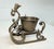 This antique 19th-century bronze Victorian sleigh shaped ring holder is a handmade collectible piece made of bronze,...