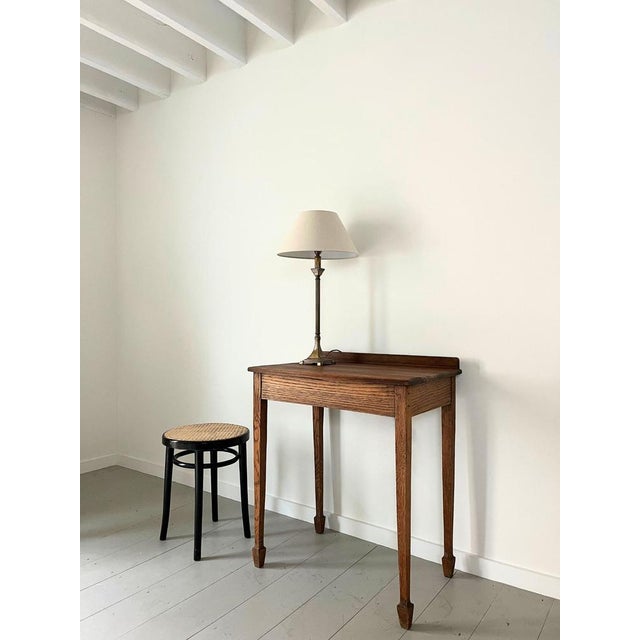 A solid brass vintage table lamp with a reeded column form. The slim stem sits on a fluted square stepped base. Rewired...