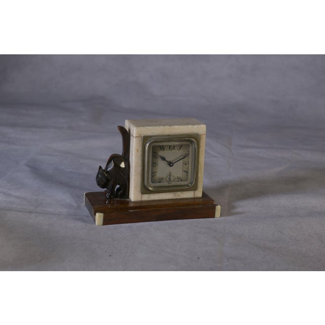 Art Deco Macassar Ebony and Marble Alarm Clock with Small Ebony Cat from Bayart, 1930s, in Very Good conditions. Designed...