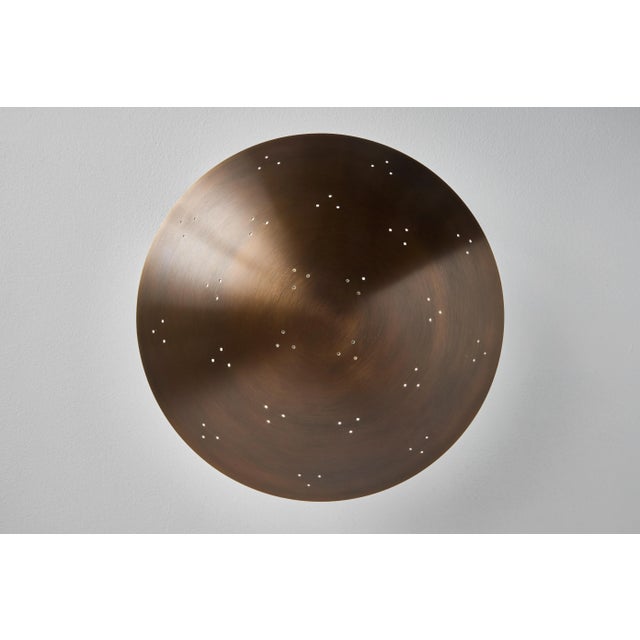 Large Raul Reyes 'Rey 26' Perforated Patinated Brass Dome Chandelier. Hand-fabricated in Los Angeles, these highly refined...