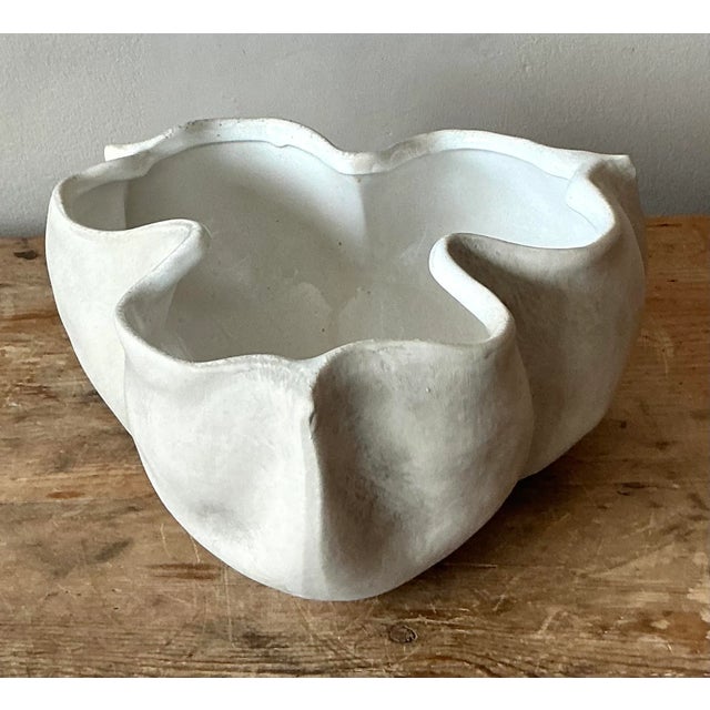 Presenting a charming vintage ceramic handkerchief bowl, an exquisite piece that effortlessly blends bohemian allure with...