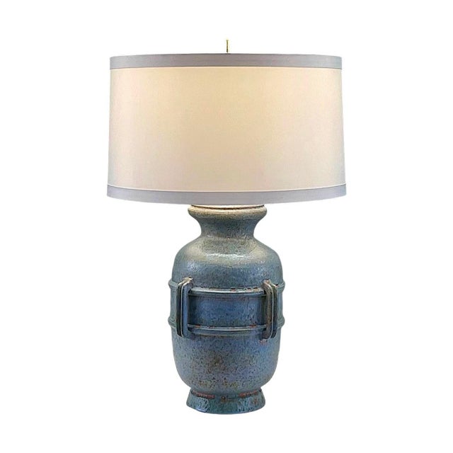 Substantial in size and presence, this Mid-Century Modern table lamp created by Raymor of Italy and attributed to the work...