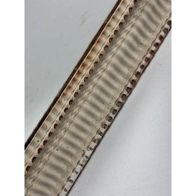 French mirror with a ribbed pattern. Made around 1900. Dimensions: 80H x 65W x 5D