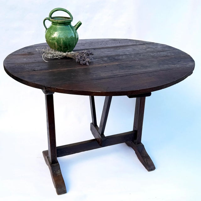 Beautiful mid-19th century French “table de vigneron” in solid walnut. Traditionally used by winegrowers between vineyard...