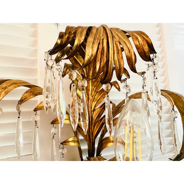 Vintage Italian gilt metal sconce palm tree with three lights will help you achieve the effect of a luxurious tropical...
