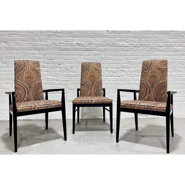 Incredible set of three Mid Century Modern Ebonized Chairs in the most perfect paisley upholstery. The backs are framed...