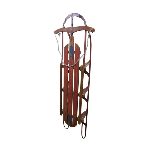This classic vintage flexible flyer-style snow sled is a nostalgic piece of winter Americana, featuring a traditional...