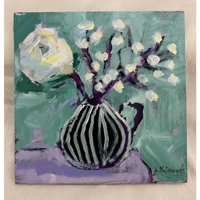 “Mint & Moonlight” is a 6” x 6” expressive still life that pairs bold contrast with delicate movement. A black, vertically...
