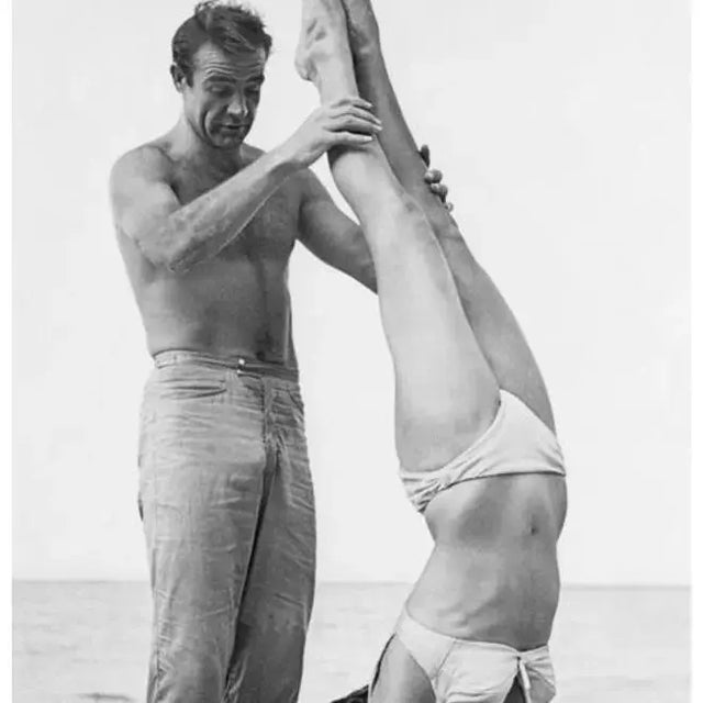 007 Catches Ursula 1962 Shirtless Scottish actor Sean Connery holds Swiss actor Ursula Andress while she does a handstand...