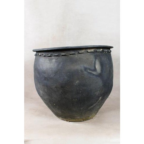 Vintage grey earthenware pot with signs of aging. These pots are hand made and are very decorative. They have a beautiful...